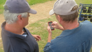 QuickLinks: Matt Murphy explaining the app to a client on the golf course